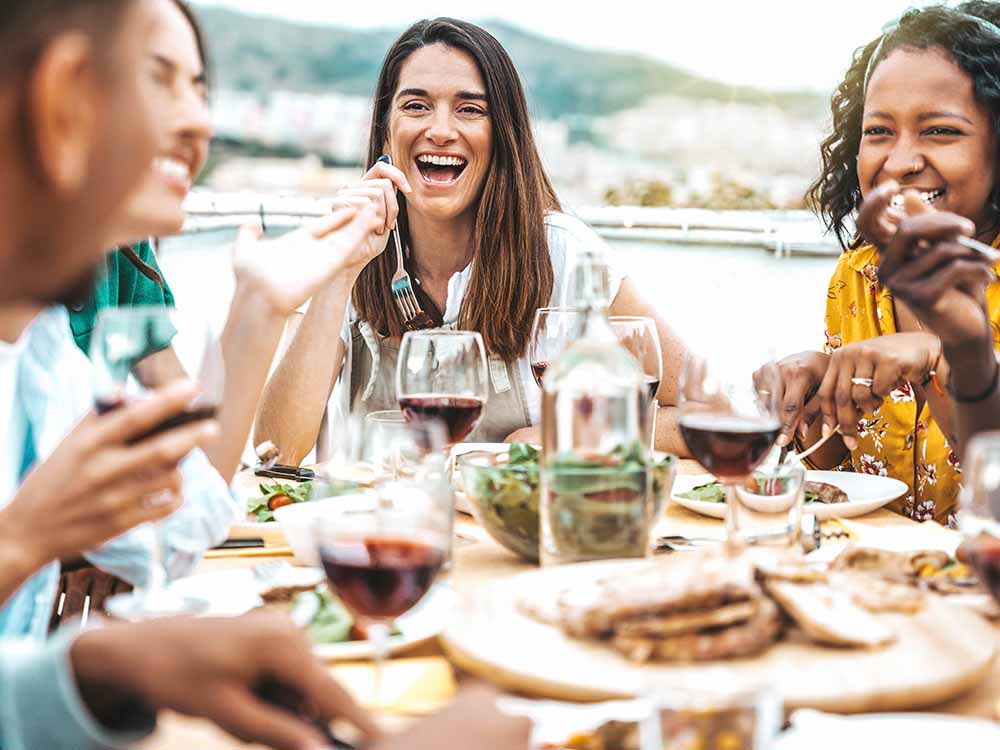 Women enjoying a celebratory dinner party together.